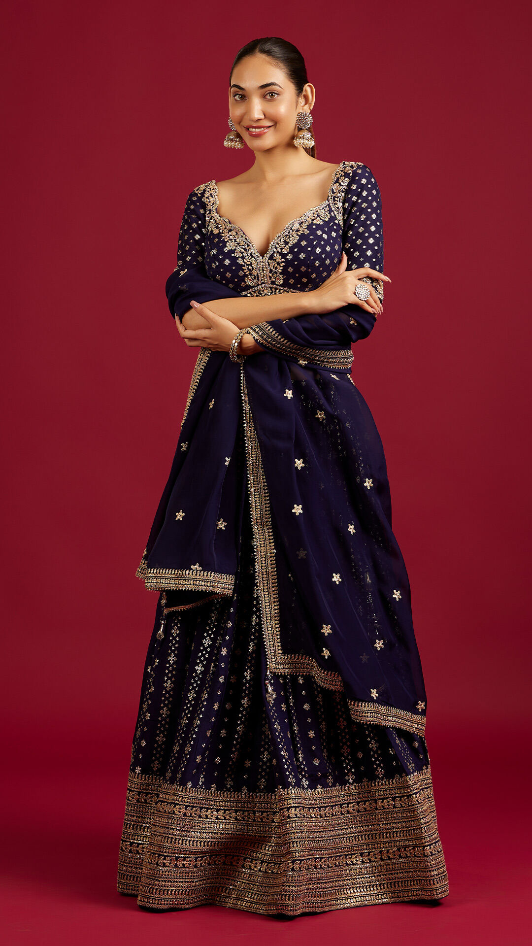 A woman flaunting a beautiful lblue ehenga choli